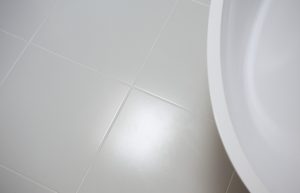 Supply and fitting of tiles and bathroom